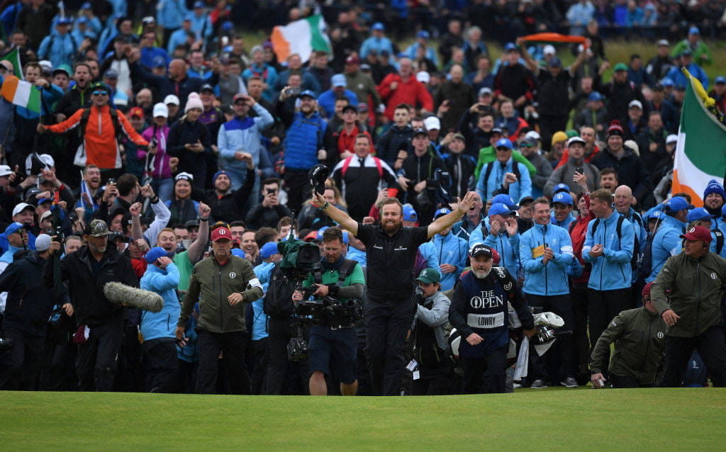 Shane Lowry, the Champion Golfer at The 148th Open, walks up the 18th at Royal Portrush